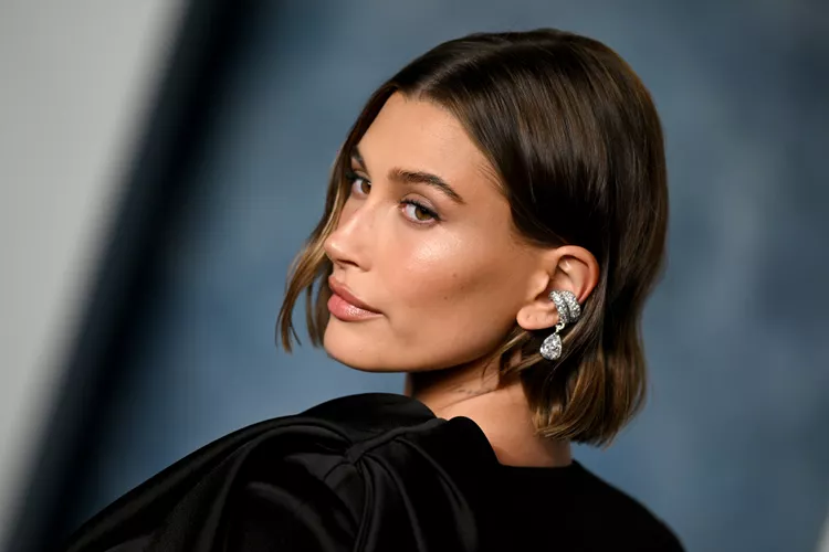 Hailey Bieber Nailed the Nautical Theme in an Off-the-Shoulder Striped Sweater and Denim Miniskirt