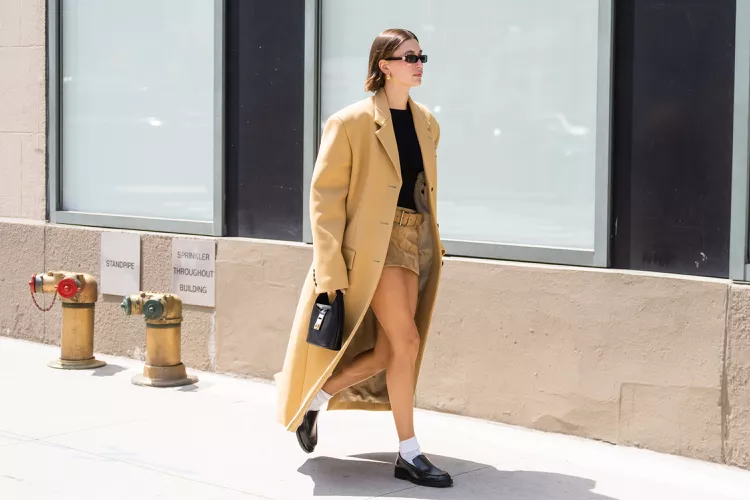Hailey Bieber Balanced Her Tiny Micro-Miniskirt With a Gigantic Camel Coat
