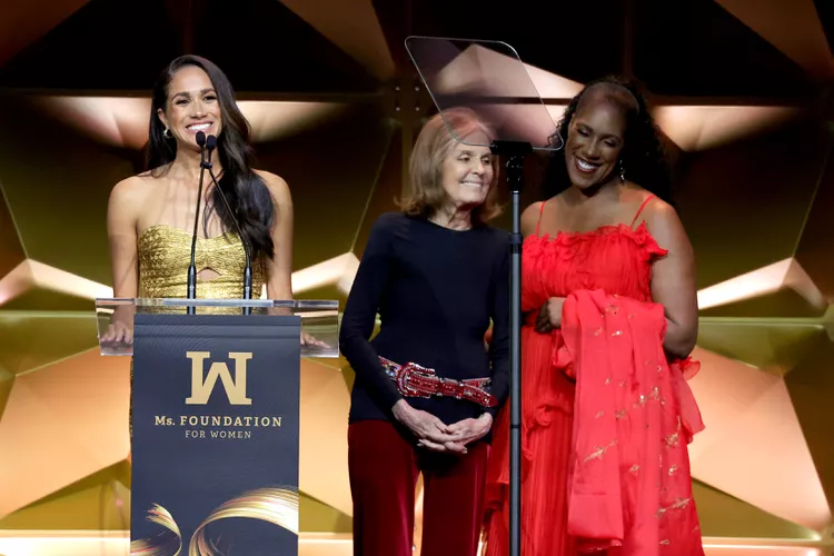 Meghan Markle Wore a Glitzy Gold Gown With a Subtle Cut-Out to Accept Her Woman of Vision Award