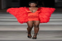 DESIGNERS WANT US WEARING RED, FURRY COATS NEXT SEASON