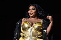 Lizzo Skipped Out on Coachella For Poolchella in a Hot Pink Bikini