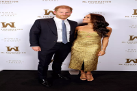 Meghan Markle Wore a Glitzy Gold Gown With a Subtle Cut-Out to Accept Her Woman of Vision Award