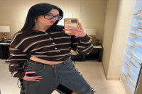Dua Lipa's Take on the Denim Midi Trend Included a Leather Twist and a Lacy Black Thong
